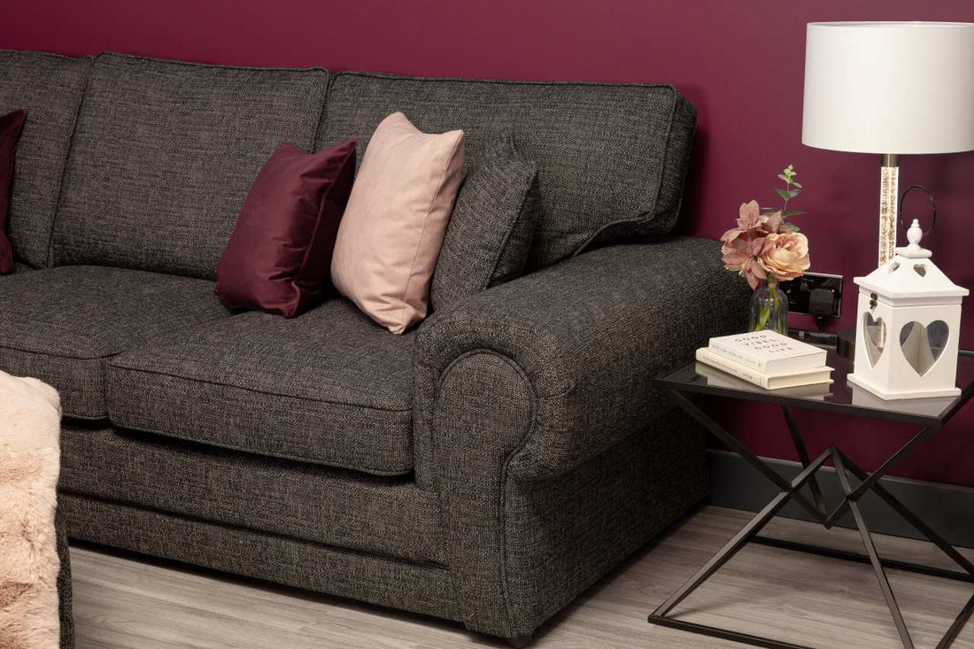 gray colored sofa with soft pillows and coffee table