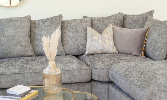 comfortable grey sofa bed with pillows